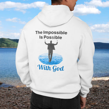 Gildan unisex zip-up hoodie with “Impossible Man” design featuring a man walking on water and uplifting message, Christian apparel made from soft cotton-poly fleece, perfect for cold weather and spiritual encouragement, man in white hoodie